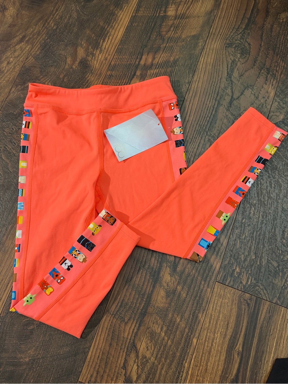 NWT Disney 100 - Kids Neon Coral Active Leggings with Disney Character Trim